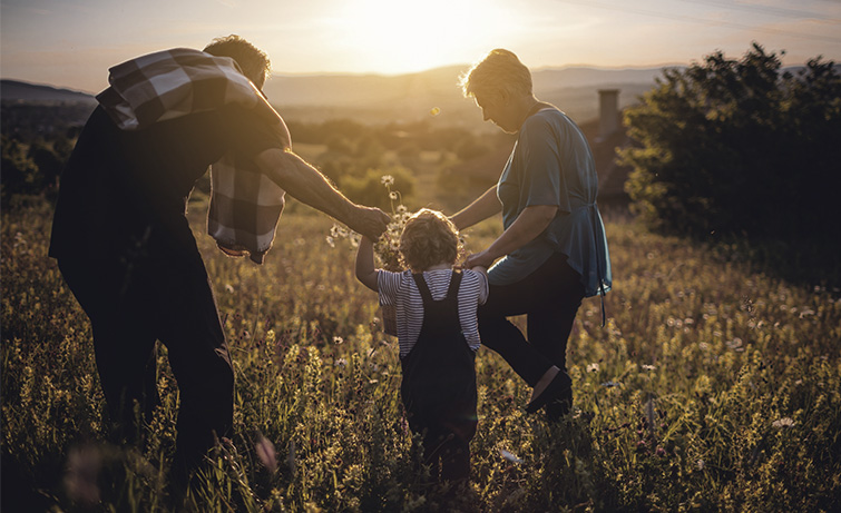 Family outdoors in a field.