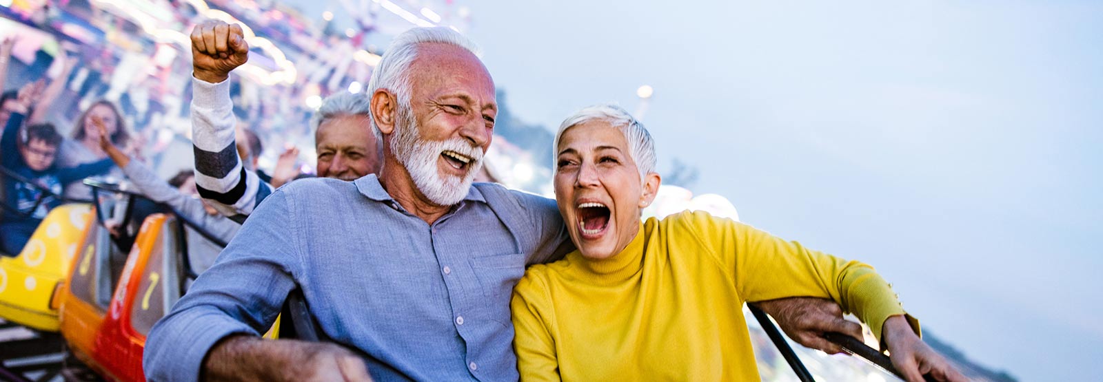 Retired couple riding a roller coaster.